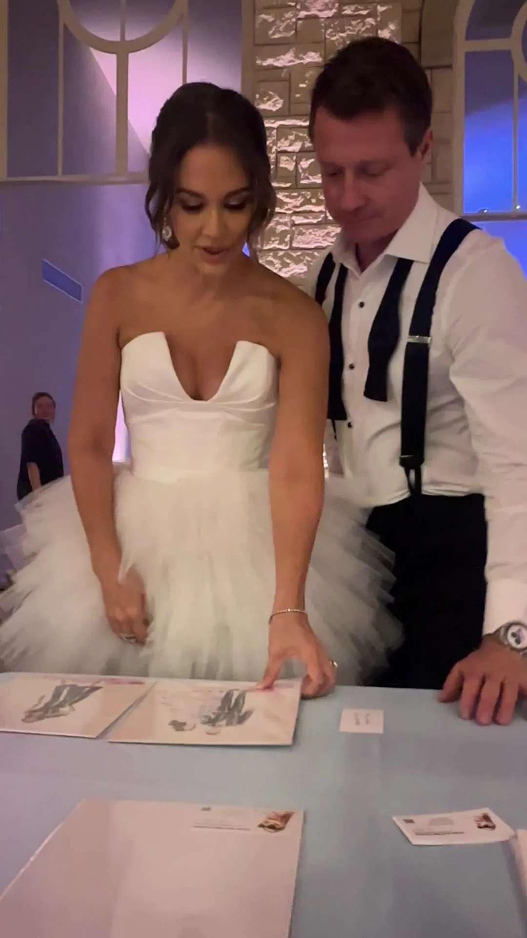 A bride and groom at the sketching table
